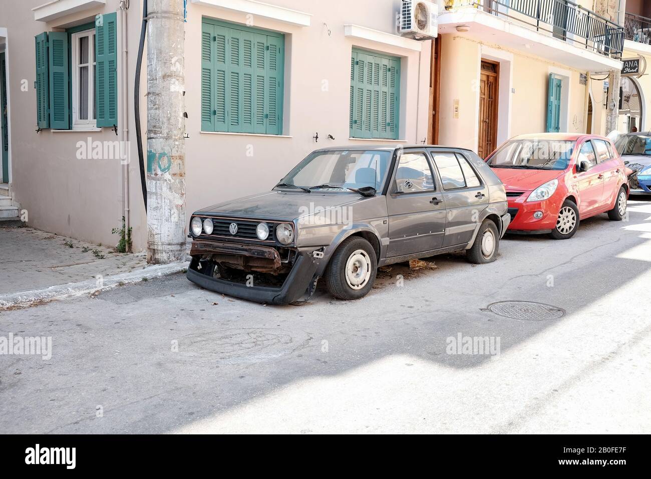 A abandoned VW golf on the streets of Zakynthos capital. Cars abandoned in  disrepair are a common site around the island Stock Photo - Alamy