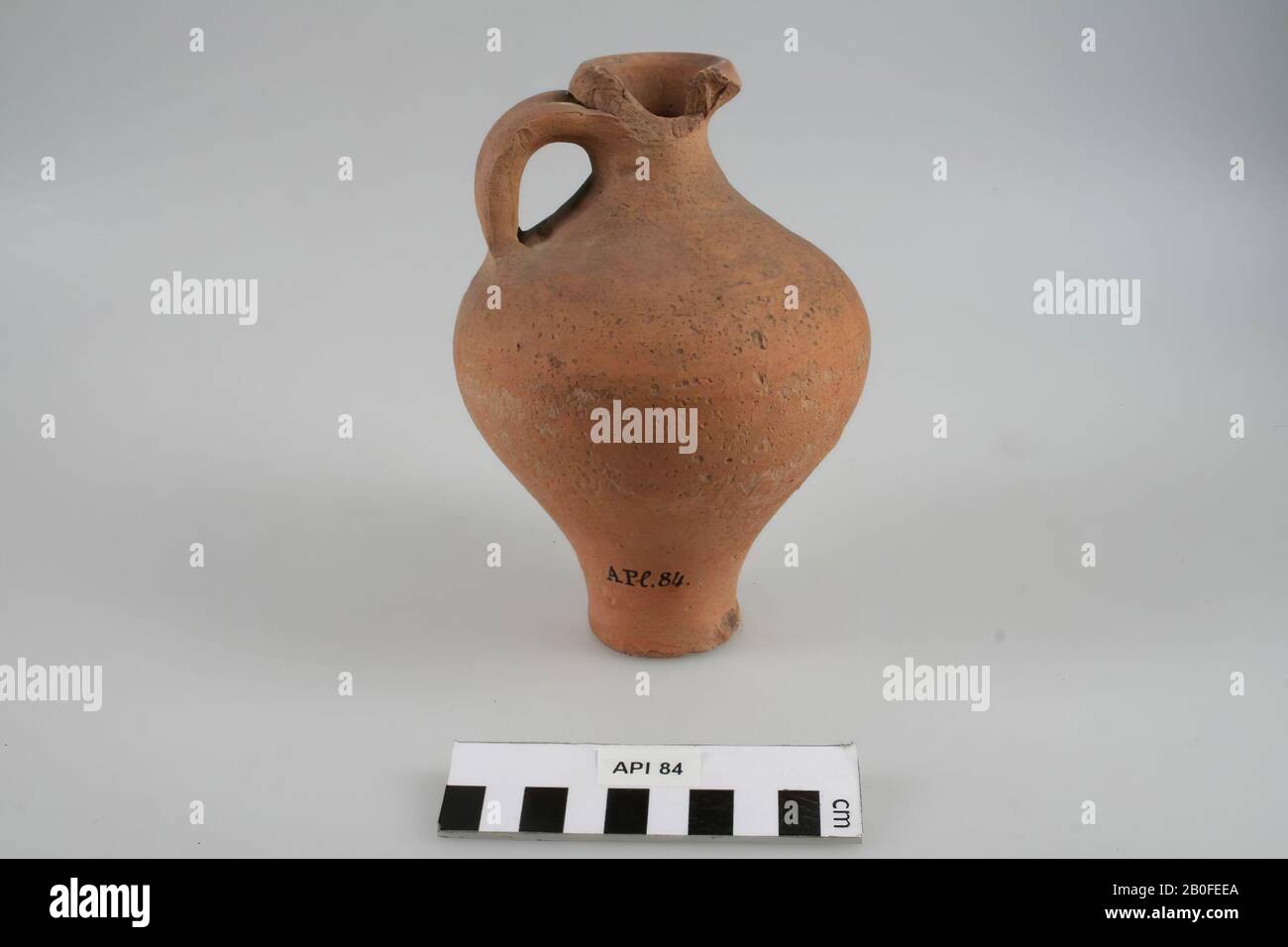 Can on high foot, one ear. Part opening is missing, some chips from the foot., Can, pottery (smooth wall), h: 16.2 cm, diam: 10.2 cm, roman 200-450, Germany Stock Photo