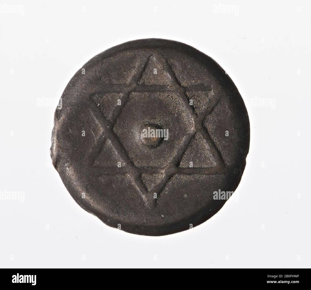Bronze coin with on the front two intersecting equilateral triangles (Star of David), on the reverse side a name in Arabic and the year 1278 (ca. 1861 AD)., Coin, falus, Morocco, metal, bronze , nt ca. 1861, Morocco Stock Photo