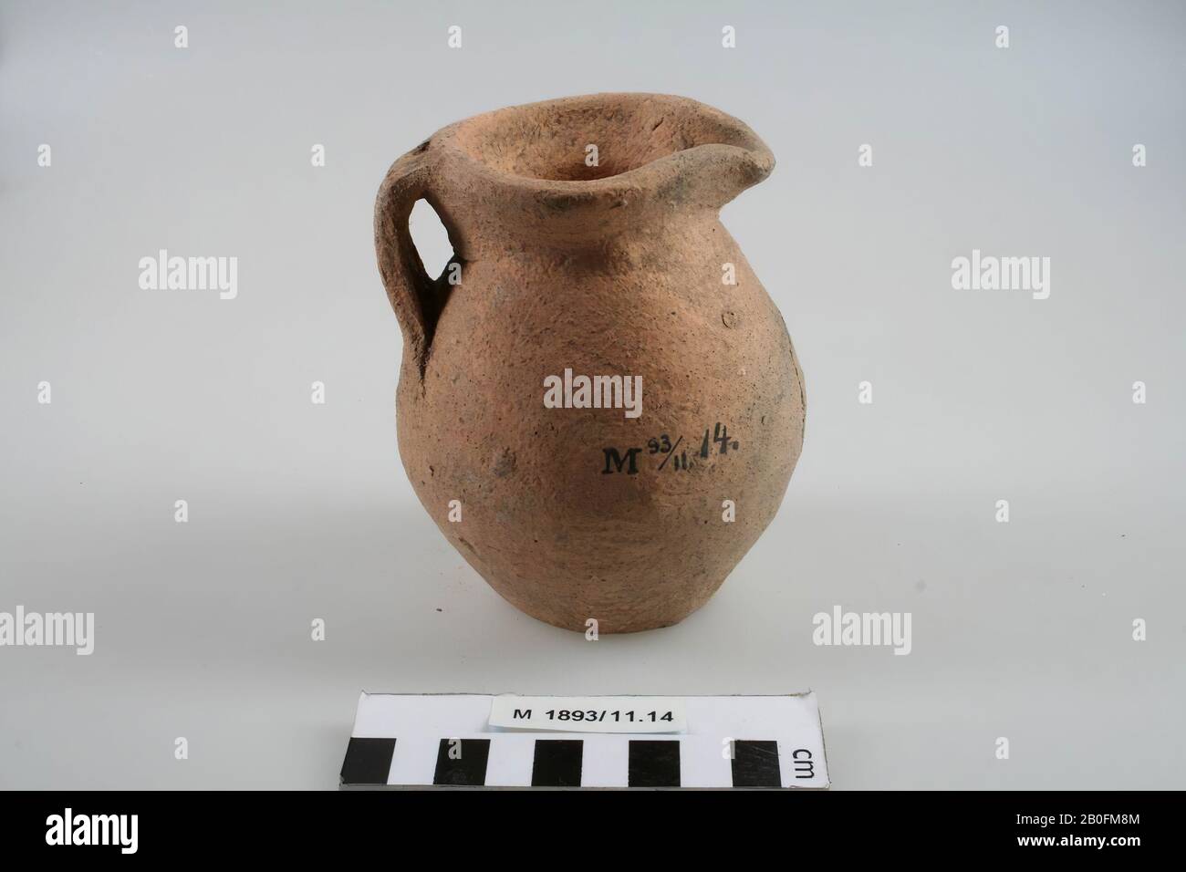 Can with cloverleaf-shaped spout and ear. Remains of a sticker on the belly, can, pottery (rough wall), h: 12,1 cm, diam: 9,9 cm, vmeb 450-700, Germany Stock Photo