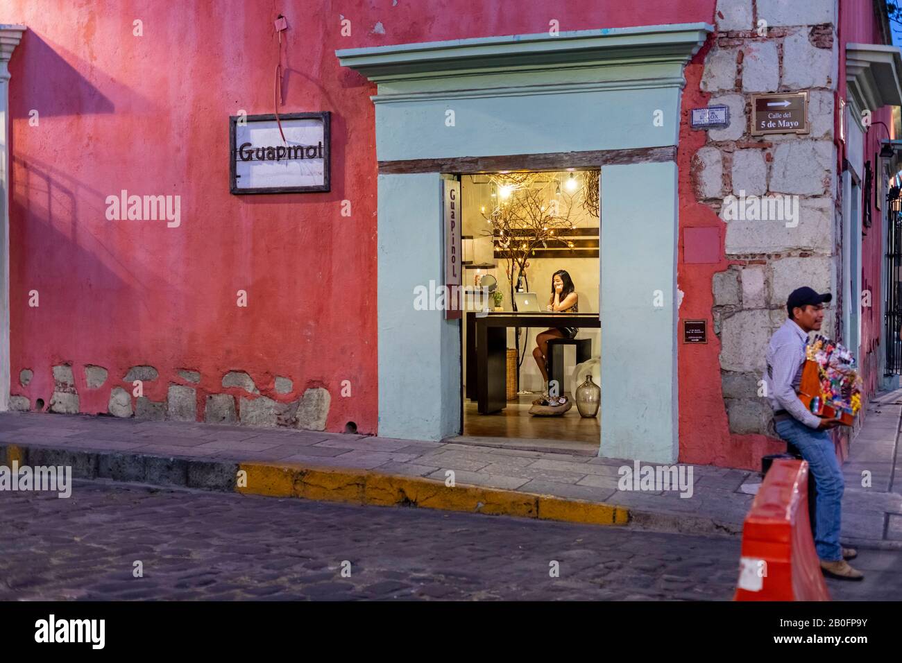 Oaxaca, Mexico - A young woman studies her laptop computer in the Guapinol jewelry store. Stock Photo