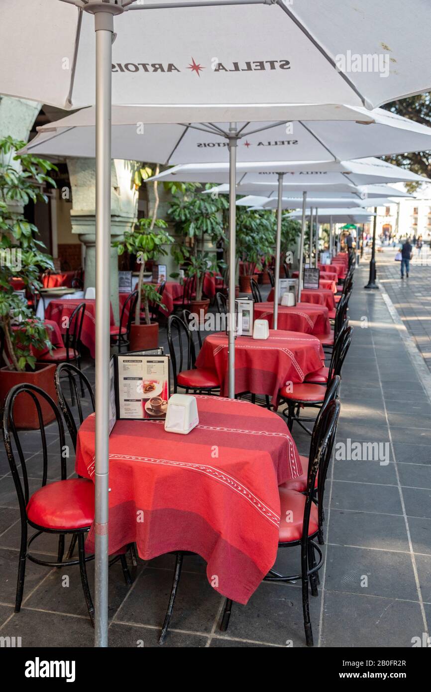 Oaxaca, Mexico - Tables at Del Jardín, a popular restaurant on the zócalo, or central square. Stock Photo