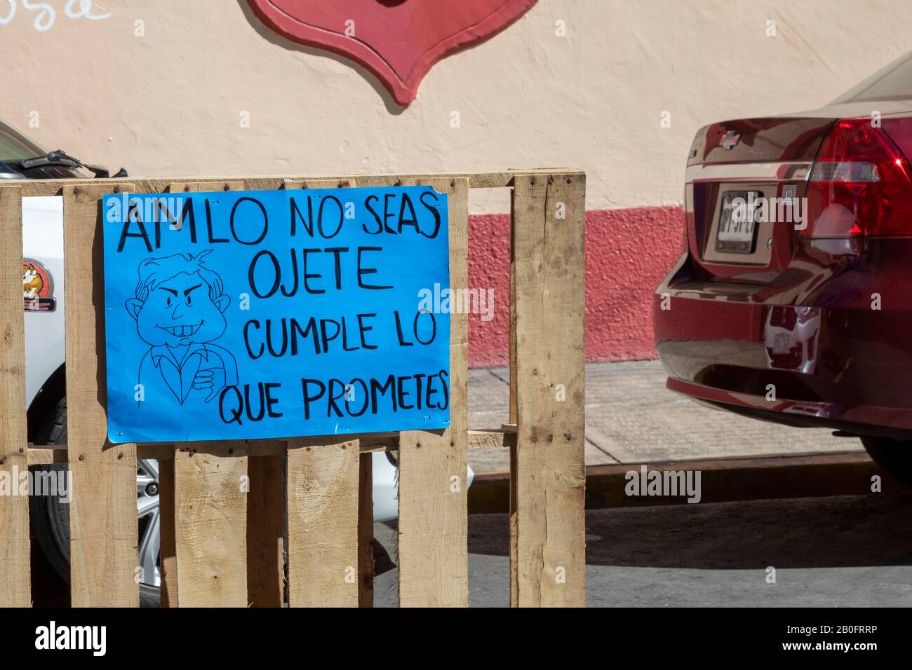 Oaxaca, Mexico - A protest sign at a street occupation calls on Mexican President Andrés Manuel López Obrador (AMLO) to fulfill his promises. Stock Photo
