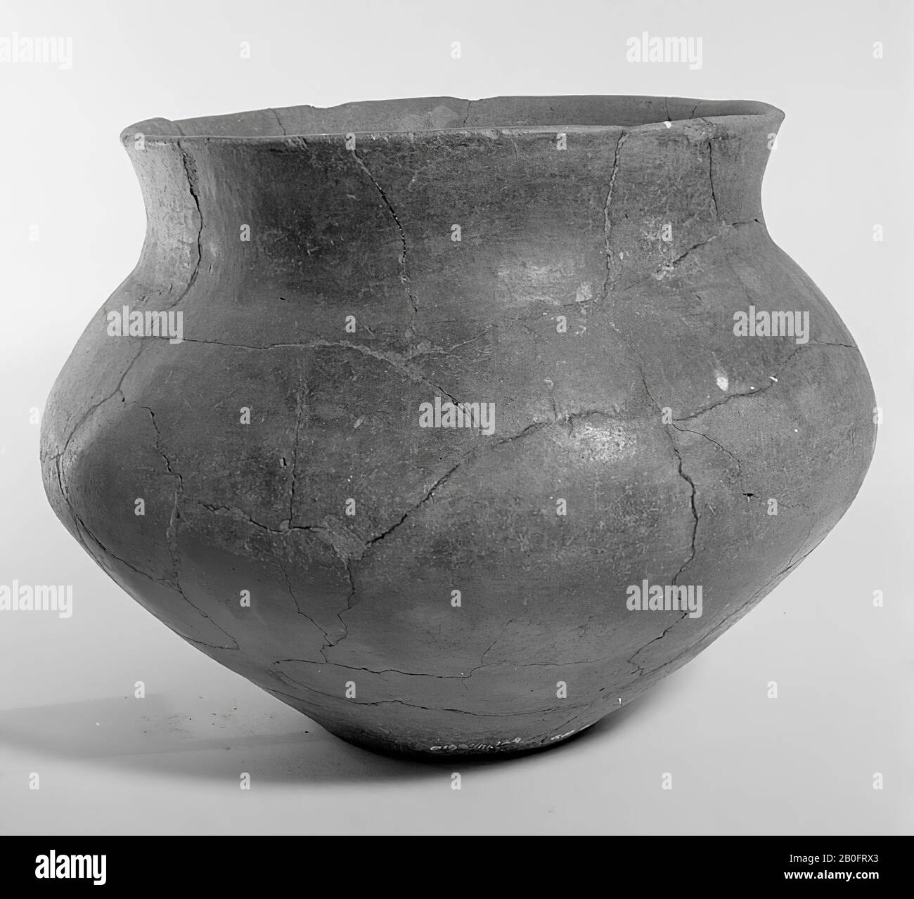 Large Hallstatt-urn of earthenware without decoration. Old bondings and additions. Contains cremated residues, urn, earthenware, h: 20.6 cm, diam: 28.7 cm, prehistory -800 Stock Photo