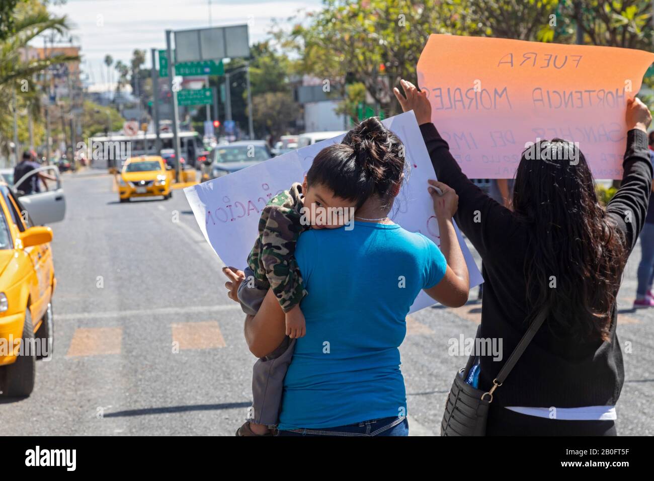 Oaxaca, Mexico - The social security workers union stages a protest by holding up signs on a major street outside the Mexican Institute of Social Secu Stock Photo