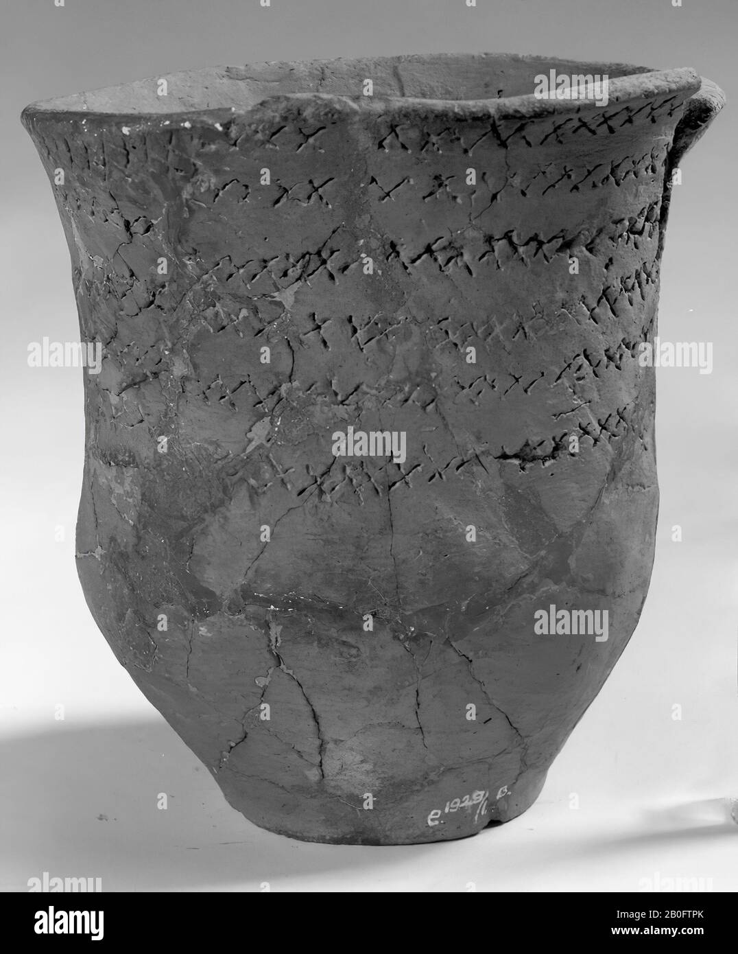 High and slender, so-called rope-cup of earthenware, the upper part of ...