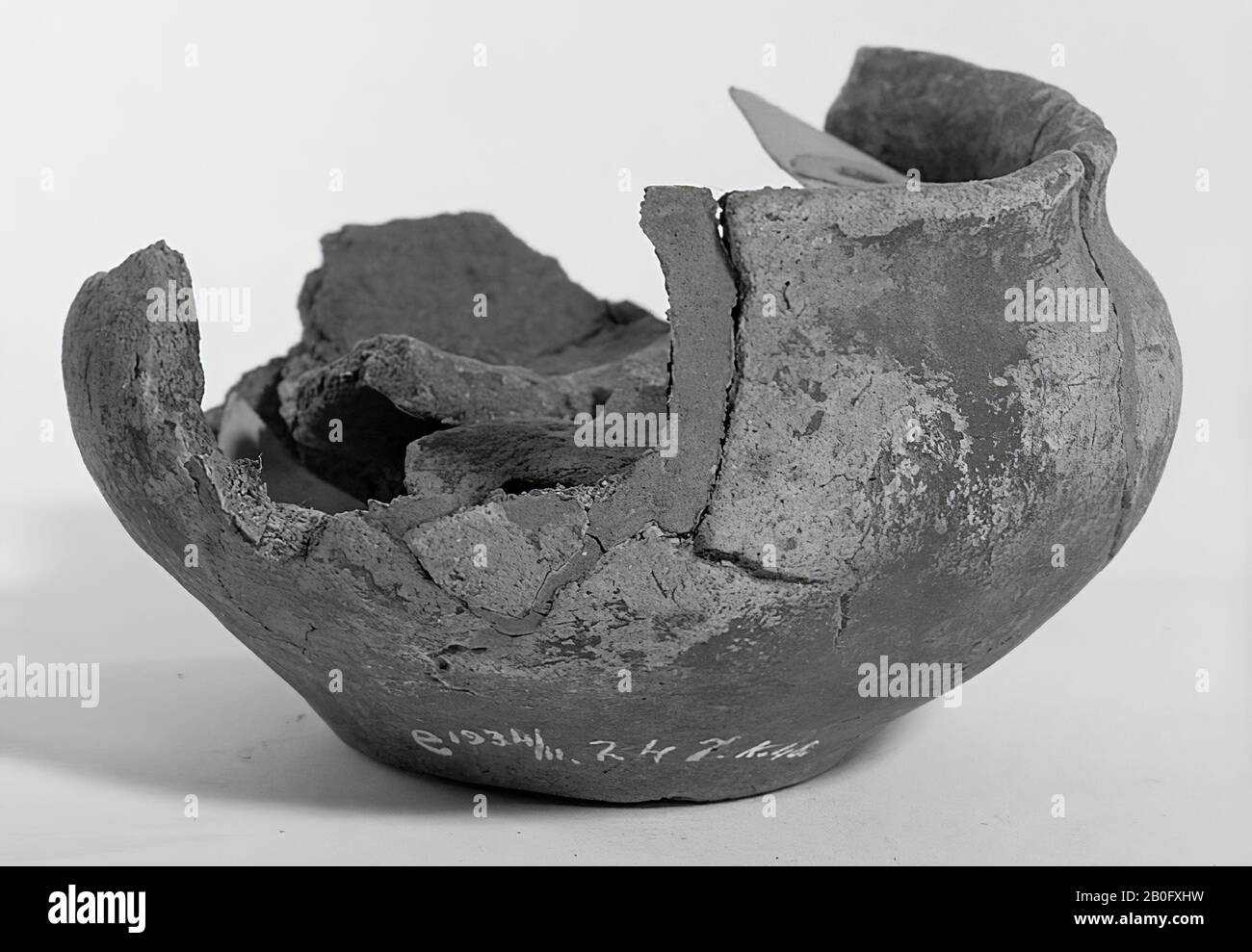 Fragment of a pottery of pottery. Old bonding, the edge is damaged