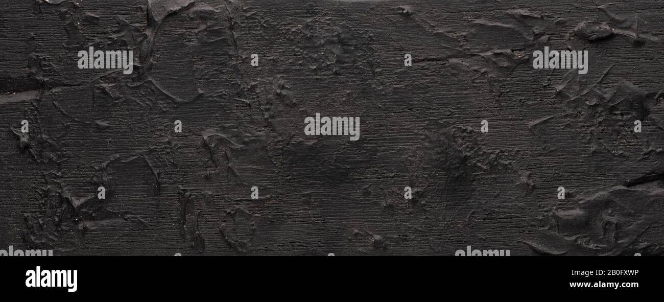 black background - a wooden textured tablet plate, with a detailed ...