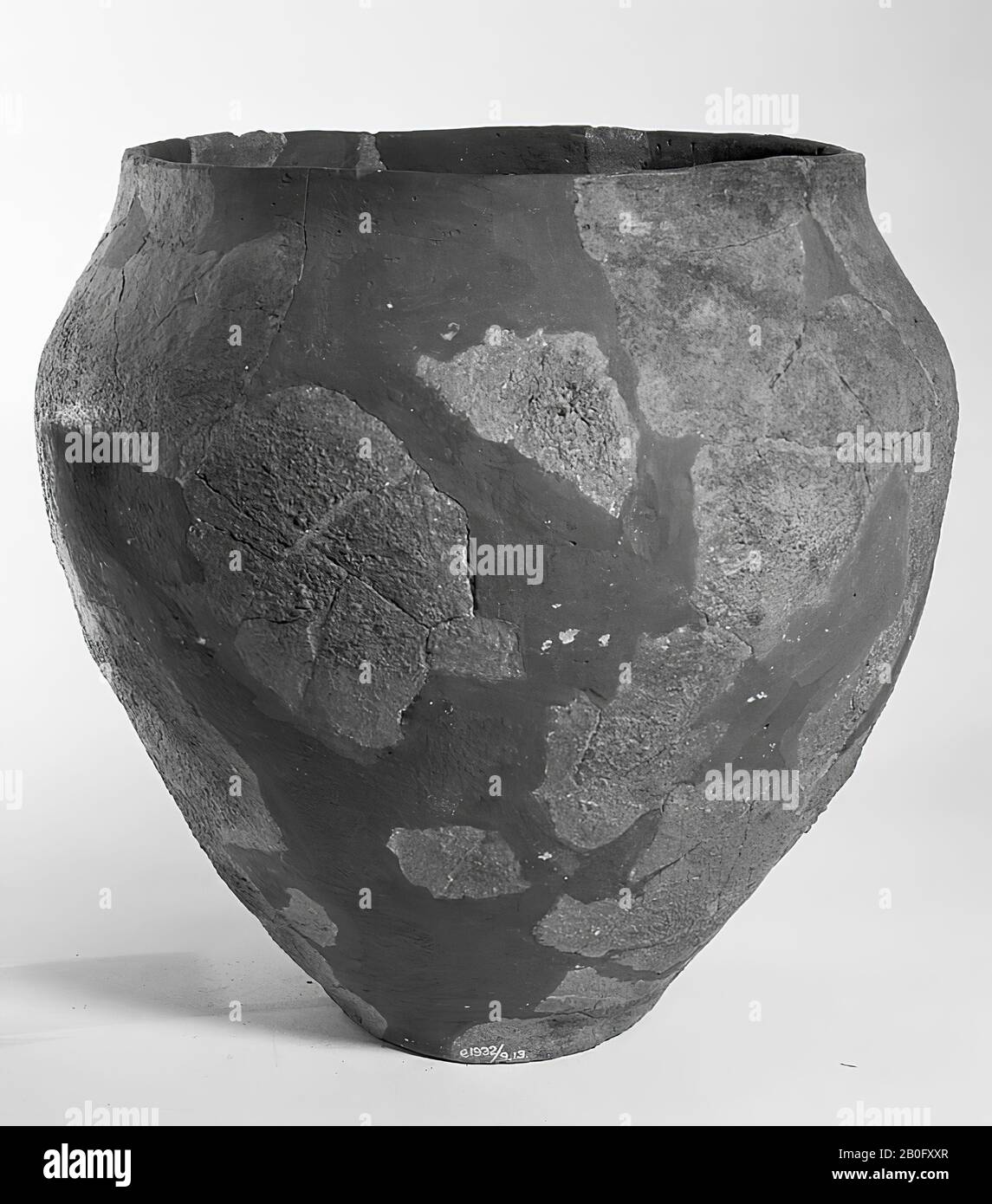 Germanic rough-walled urn of earthenware. Old bondings and additions, cracks. Contains cremated residues, urn, earthenware, h: 26.5 cm, diam: 27 cm, prehistory -800 Stock Photo