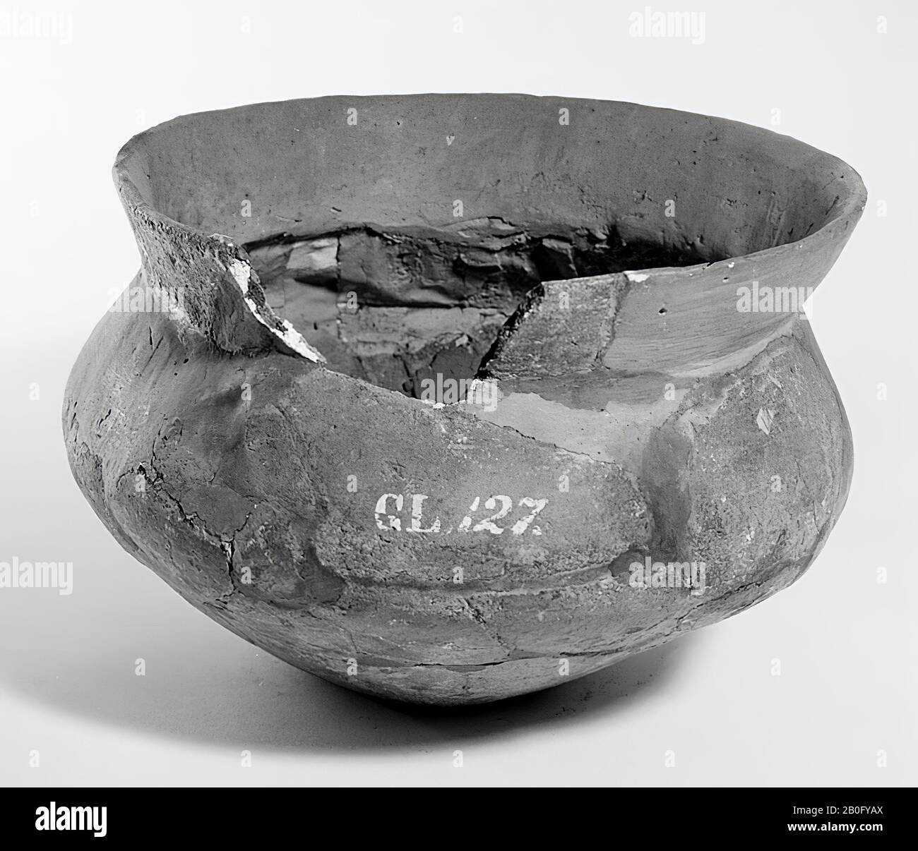 Dark gray urn of earthenware with outstanding edge. Old bondings and additions, 1 loose edge shard., Urn, earthenware, h: 16.3 cm, diam: 23 cm, prehistory -1200 Stock Photo