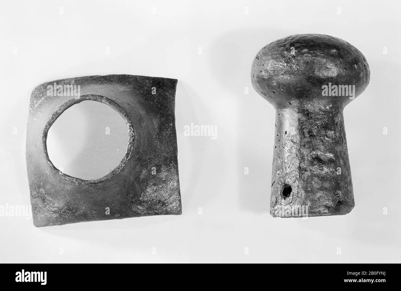 casting of a button of a tiller tree. Conical sleeve with two holes at the base, topped with a slightly flattened head with central drilling, casting, knob, plaster, 5.6 x 3.8 cm, prehistory 1968-1969, Netherlands, Gelderland, Wijchen, Wijchen, Wereldsche mountain Stock Photo