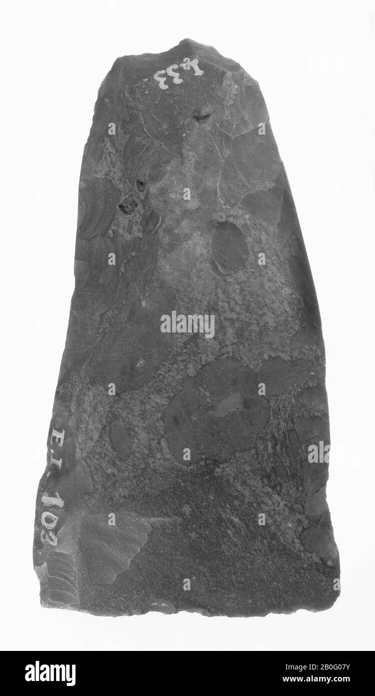 flint wedge, worked by splitting, very little polished, the cut sharply sharpened on both sides. The whole on the inside a somewhat hollow formed, ax, stone, flint, length: 8.1 cm, prehistory -4000 Stock Photo