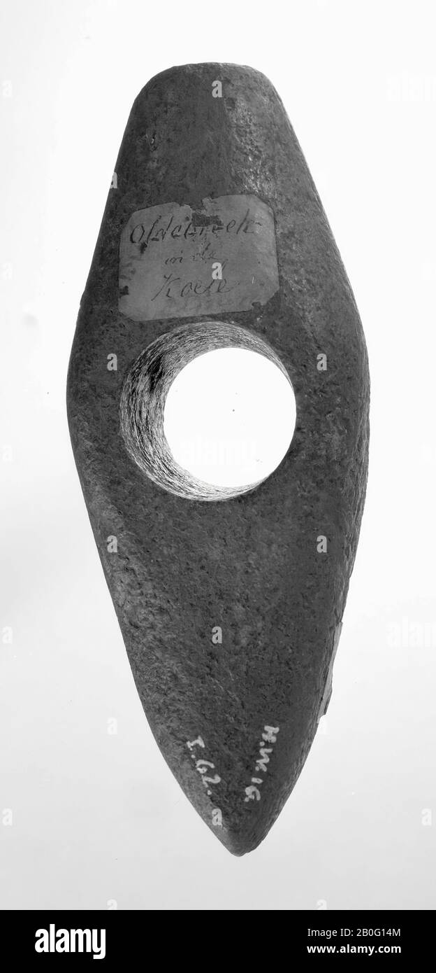 wedge or ax of quartz, provided in the middle of a pierced hole, to attach to a stick, hammer, stone, length: 13 cm, prehistory -2900 Stock Photo