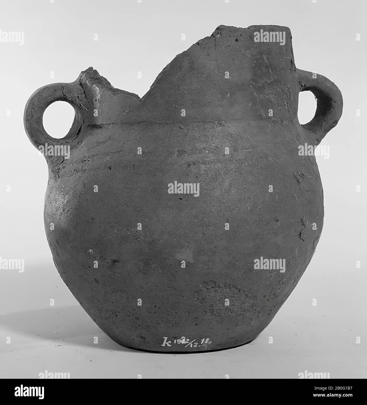 Urn of earthenware of strange shape, reminiscent of Protosaksian urns, plump with broad foot, tapered edge and ears. Found in this jar in 1912 Stock Photo