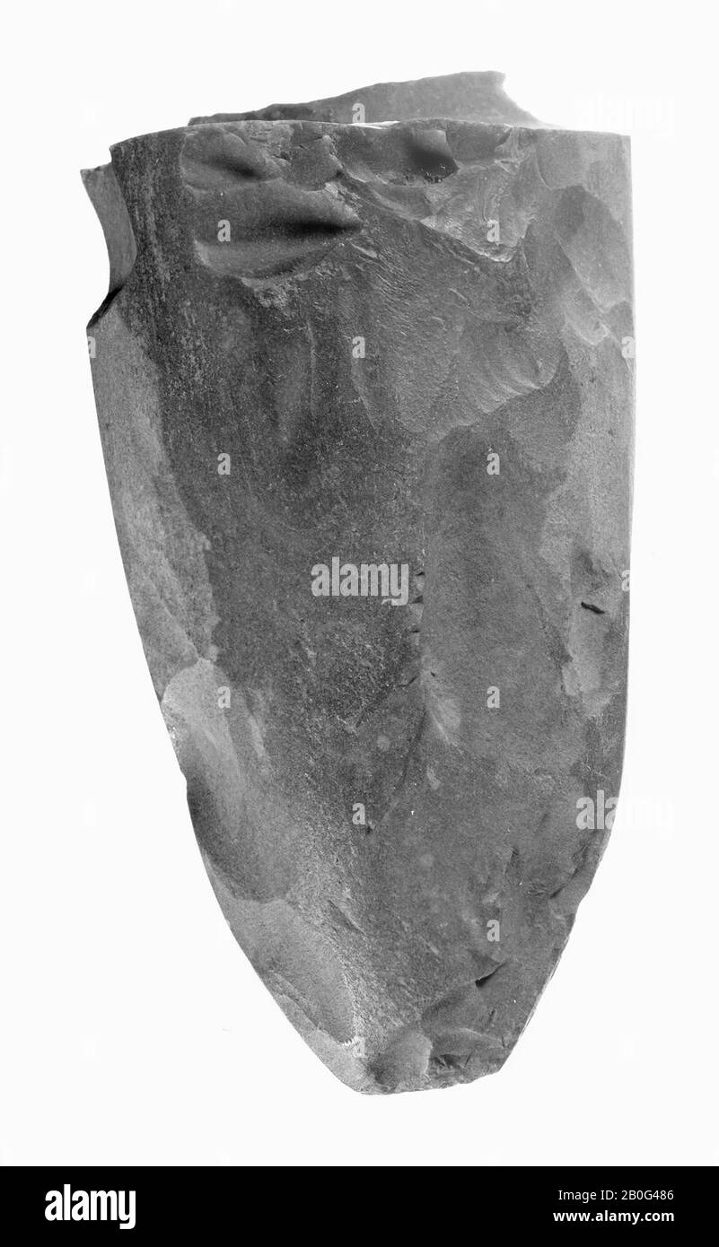 large top part of a spiked ax of gray and brown spotted (Lousberg) flint. Cortex parts on one side. Very partly sharpened. Point shows secondary use as a tipping stone. Rupture surface used as face, ax fragment, stone, flint, length: 10.2 cm, prehistoric -4000 Stock Photo