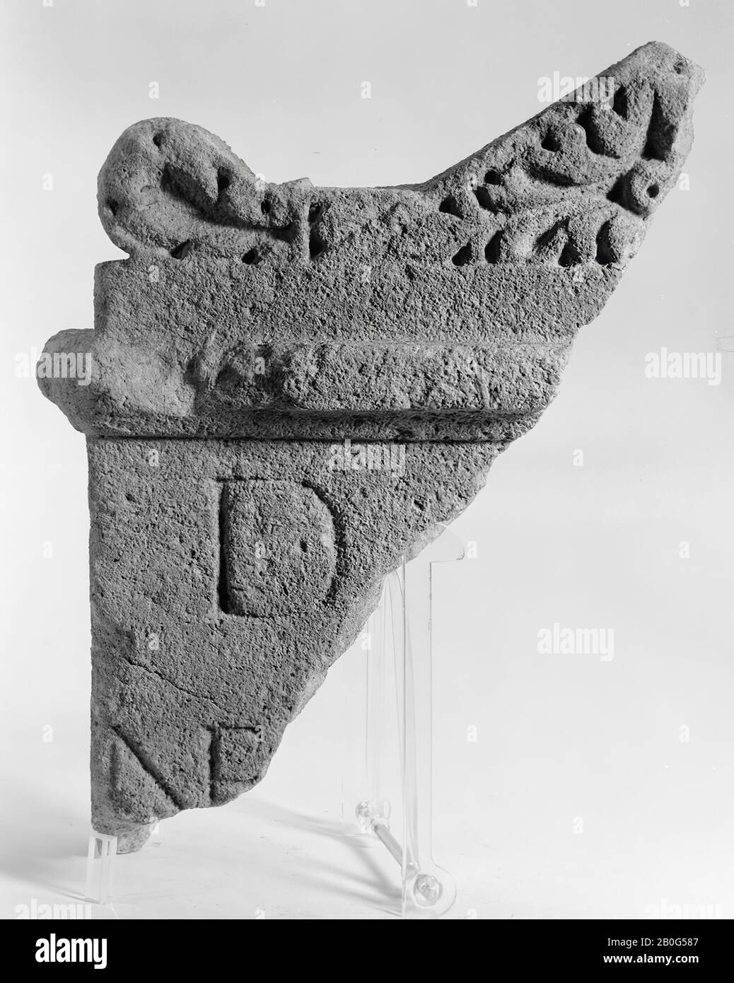 Left upper corner of an altar without a niche. Limestone. The fraction runs from about mid-top to the beginning of the second line of the inscription on the left. The back is broken away. Has the original width Stock Photo