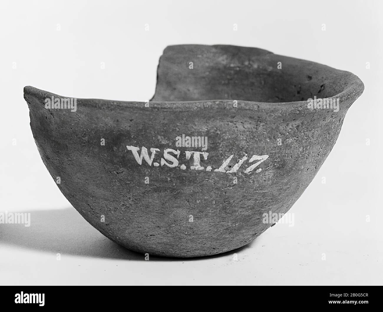 Gray bowl of earthenware. Addition, gap in the edge Stock Photo