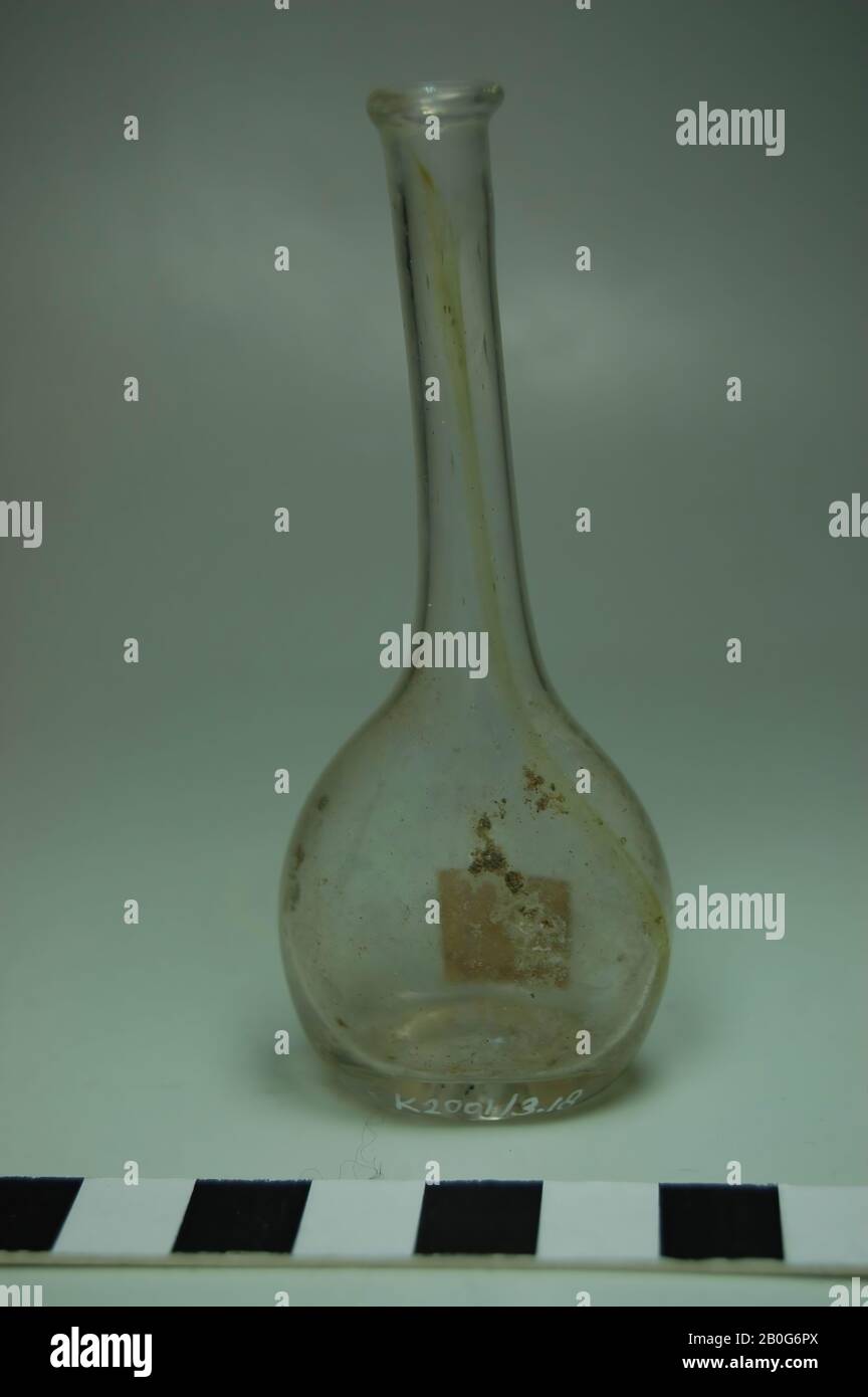 Spherical bottle with long neck of transparent glass. Pressed soil. Old inventory number: M 496., bottle, glass, Height: 9.3 cm, Roman 50-100, The Netherlands, Gelderland, Zaltbommel, Poederoijen, Loevestein castle Stock Photo