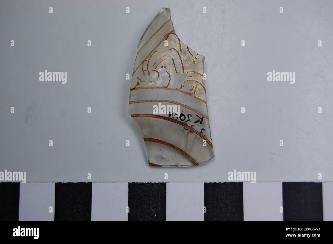 Glass shard with the colors red and gold. Air bubbles in the glass. Old number: 12287., shard, glass, 4.5 x 2 cm, Roman 50-100, Egypt Stock Photo