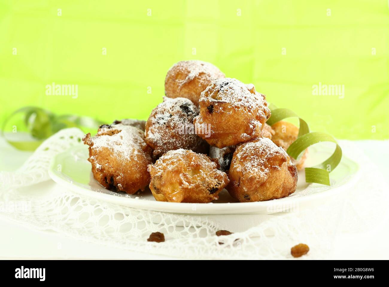 Concept of italian food. Top view of homemade traditional carnival sweets: carnival italian fritters with sultanas. Copy space. Stock Photo