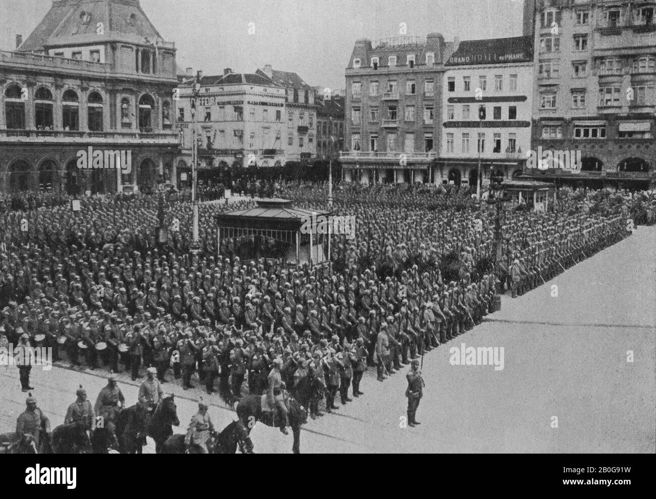 The occupation of Brussels in Belgium in August 1914 by German troops during World War One symbolised by a parade of soldiers in the Place du Marche Stock Photo