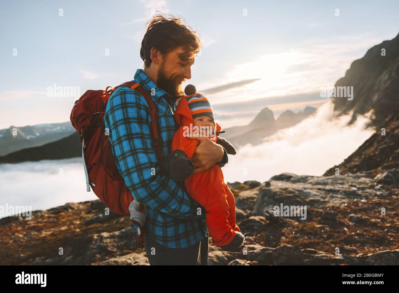 Father with infant baby family traveling vacations in mountains together active healthy lifestyle man with kid hiking outdoor Stock Photo