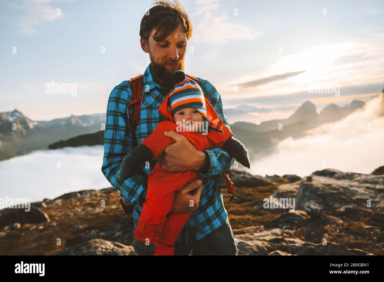 Father traveling with baby in mountains family vacations hiking healthy lifestyle man with child