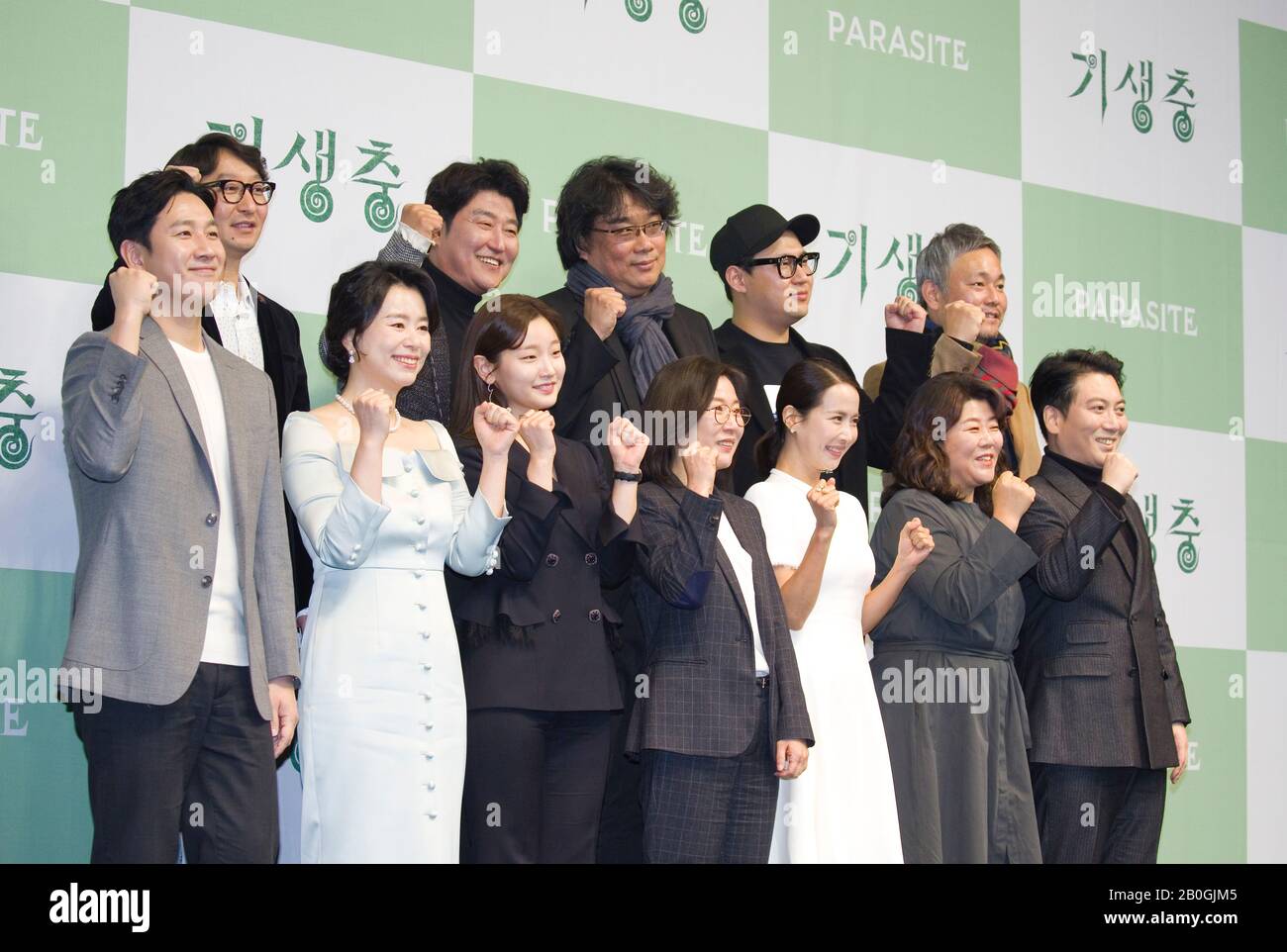Yang Jin-Mo, Song Kang-Ho, Bong Joon-Ho, Han Jin-Won, Lee Ha-Jun, Lee Sun-Kyun, Jang Hye-Jin, Park So-Dam, Kwak Sin-Ae, Cho Yeo-Jeong, Lee Jung-Eun and Park Myung-Hoon, Feb 19, 2020 : (L-R, 2nd row) Film editor Yang Jin-Mo, actor Song Kang-Ho, director Bong Joon-Ho, screenwriter Han Jin-Won and production designer Lee Ha-Jun pose with (L-R, front row) cast members Lee Sun-Kyun, Jang Hye-Jin, Park So-Dam, film producer Kwak Sin-Ae, cast members Cho Yeo-Jeong, Lee Jung-Eun and Park Myung-Hoon during a press conference held for their Oscar-winning film 'Parasite' in Seoul, South Korea. The Korean Stock Photo