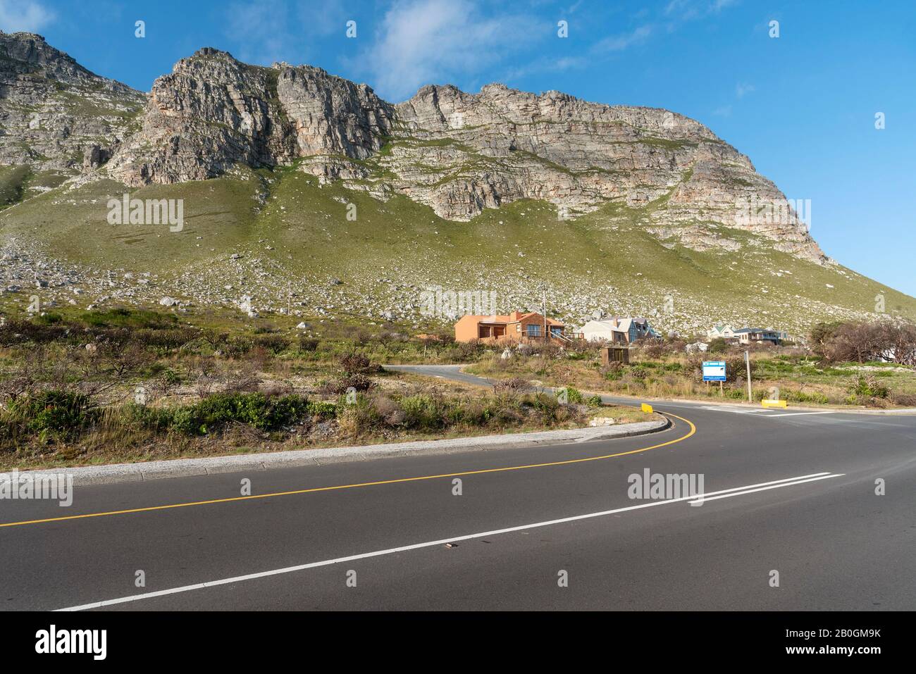 Bettys Bay, Western Cape, South Africa. Dec2019.  The Hottentots Holland mountains overlook Clarence Drive, the R44 highway in evening light at Bettys Stock Photo