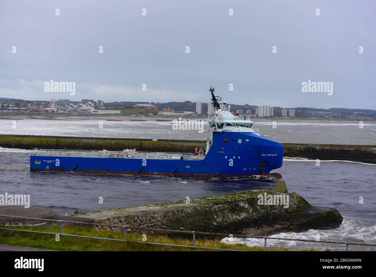 The oil supply vessel Sea Tantalus leaving Aberdeen en-route to the North Sea oil fields. Stock Photo
