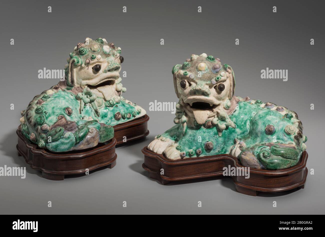Chinese, Pair of Fu Lions Passant, Porcelain, Height: 3 1/2 in. (8.9 cm Stock Photo