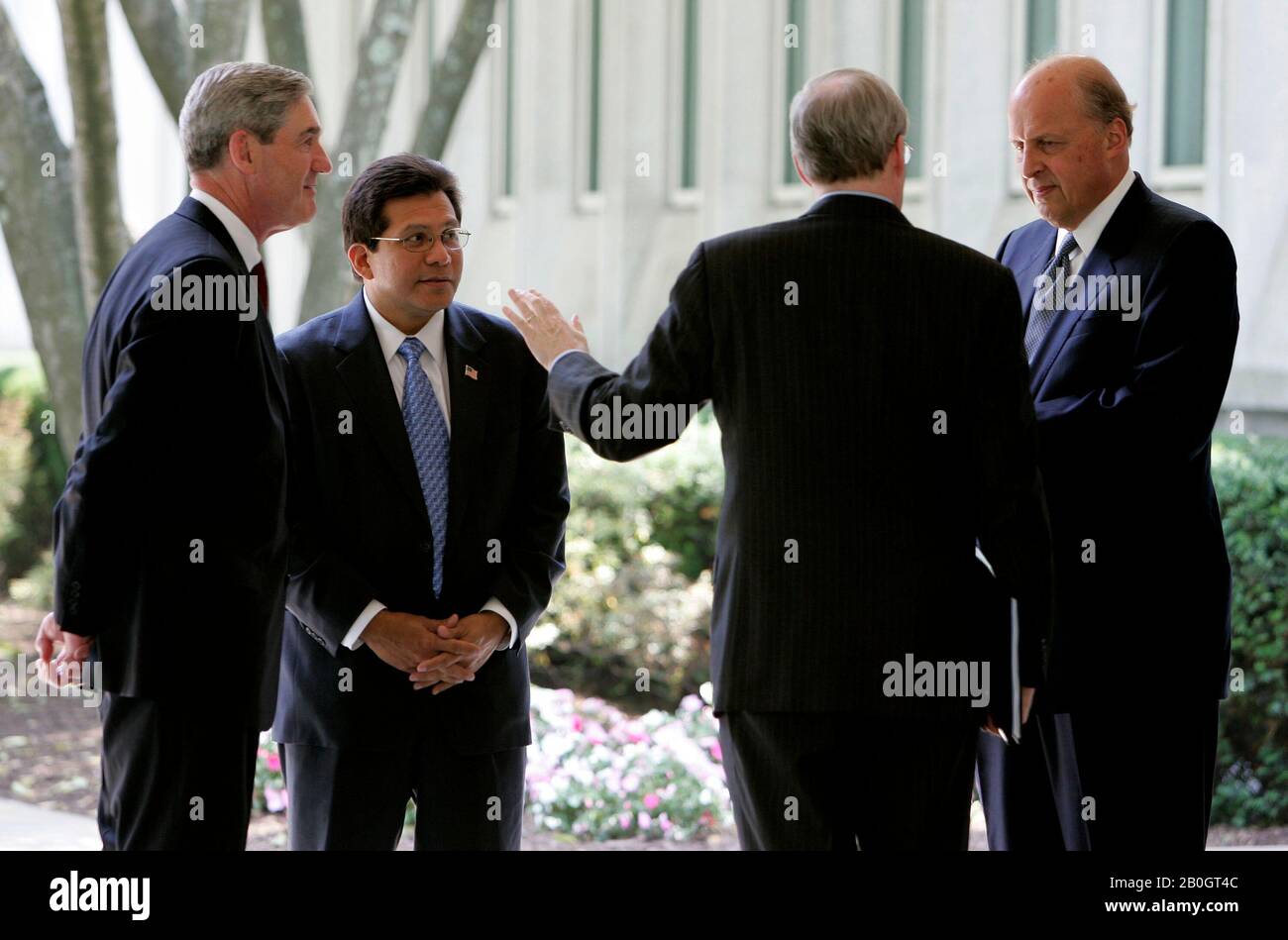 Langley, VA - May 31, 2006 -- Four of the top United States Justice Department and Intelligence officials, left to right: Federal Bureau of Investigation (FBI) Director Robert Mueller;  Attorney General Alberto Gonzales; National Security Advisor Stephen Hadley; and National Intelligence Director John Negroponte talk outside Central Intelligence Agency (CIA) headquarters following a ceremonial swearing in for new CIA Director General Michael Hayden in Langley, Virginia Wednesday 31 May 2006. Credit: Matthew Cavanaugh-Pool via CNP / MediaPunch Stock Photo