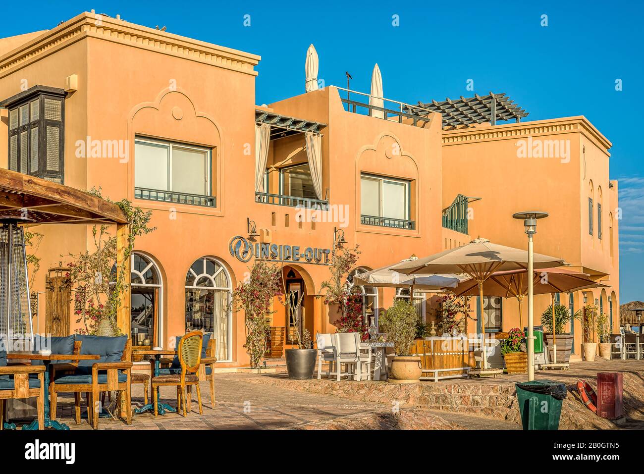 outdoors restautant in an old colourful Egyptian house in the evening sunshine, el Gouna, Egypt, Jannuary 17, 2020 Stock Photo