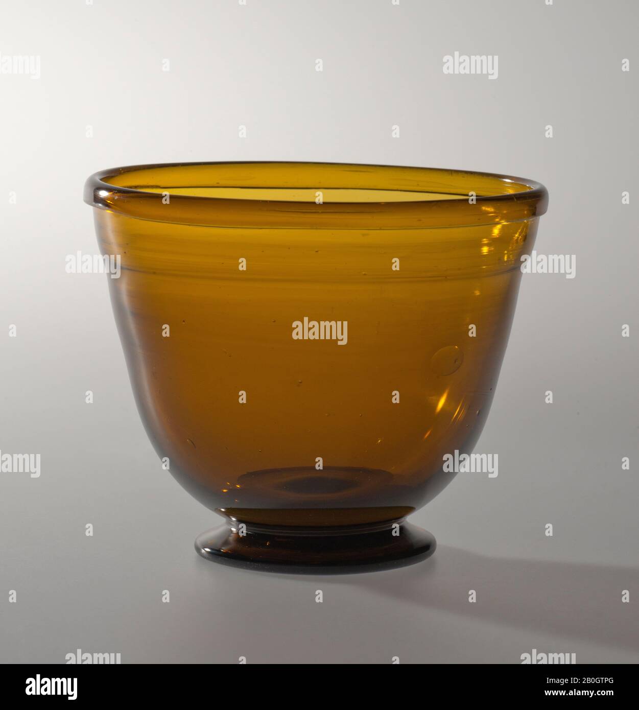 Maker unknown, Bowl, 19th century, Amber glass, Height: 3 in. (7.6 cm Stock Photo