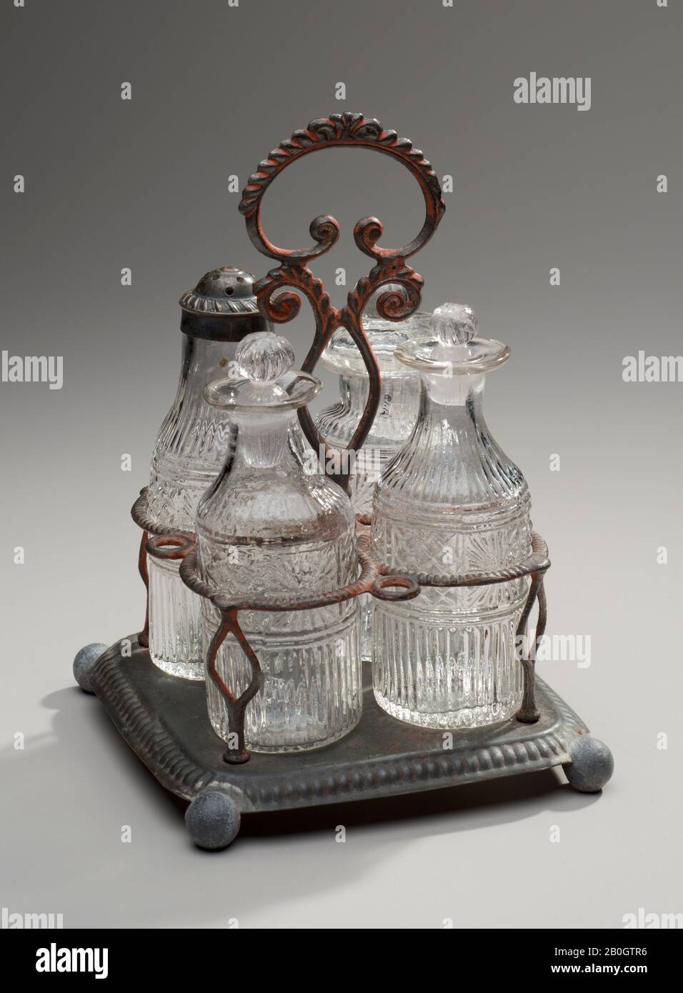 Maker unknown, Castor Set and Stand, c. 1820–40, Colorless lead glass, tin, and paint Stock Photo
