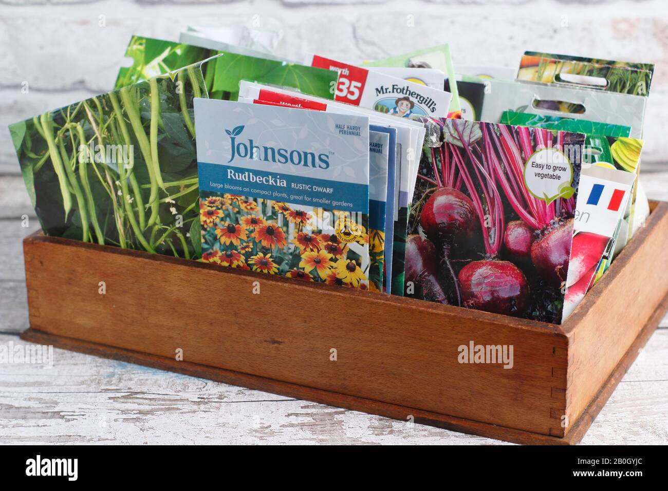 Vegetable and flower seed packets in a wooden box. UK Stock Photo