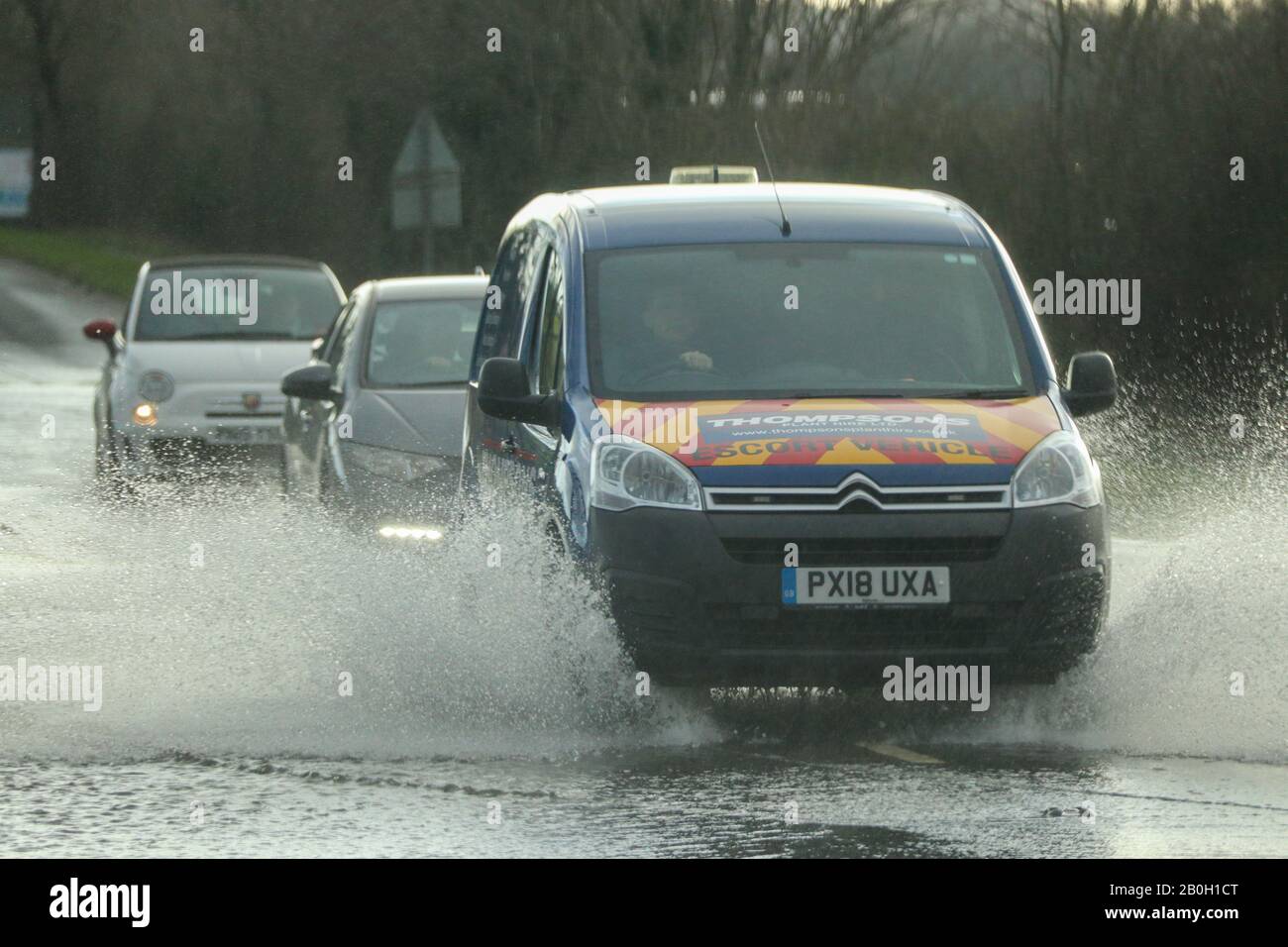Carnforth Lancashire, United Kingdom. 20th Feb, 2020. Flooding on the A6 caused by run of from surrounding farm land caused River Keer to burst it banks and flood the A6 Credit: Photographing North/Alamy Live News Stock Photo