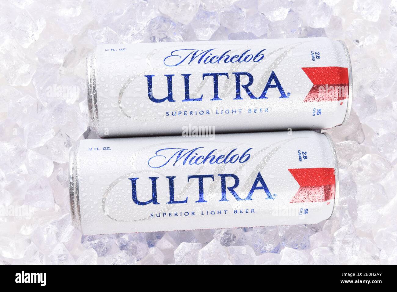 IRVINE, CA - AUGUST 6, 2018: Two Michelob Ultra beer 12 ounce cans in ice. A a low carb and low calorie light beer from Anheuser-Busch. Stock Photo