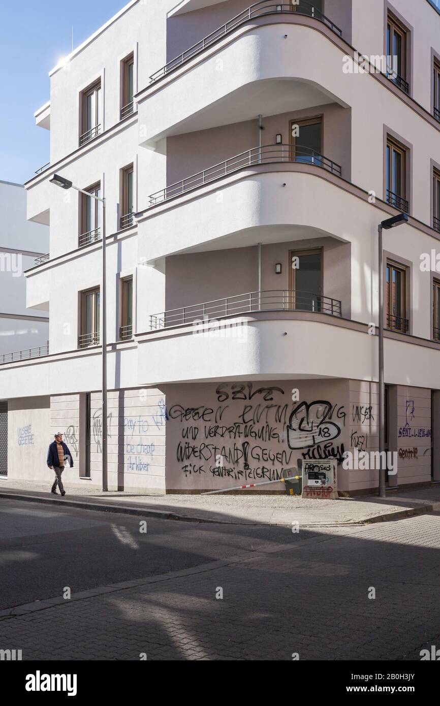 05.10.2018, Leipzig, Saxony, Germany - New residential building and slogans against gentrification in Leipzig-Connewitz. 00P181005D094CAROEX.JPG [MODE Stock Photo
