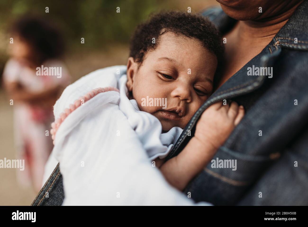 Close up of newborn baby girl laying on mother's chest Stock Photo Alamy