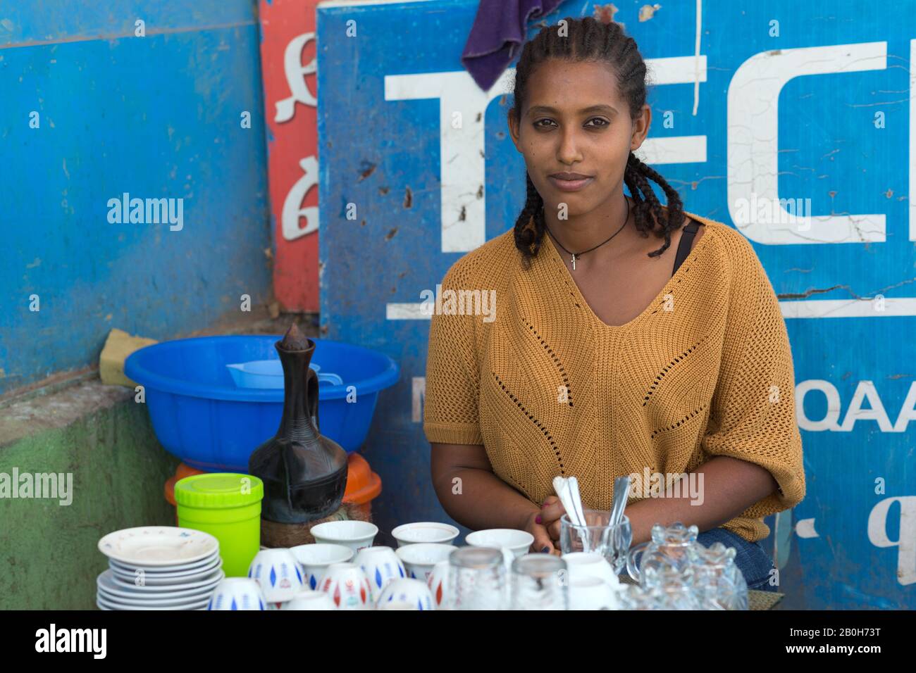 02.11.2019, Adama, Oromiyaa, Ethiopia - Traditional street coffee seller. Internally displaced person (IDP) from the Amhara region supported by the Wo Stock Photo