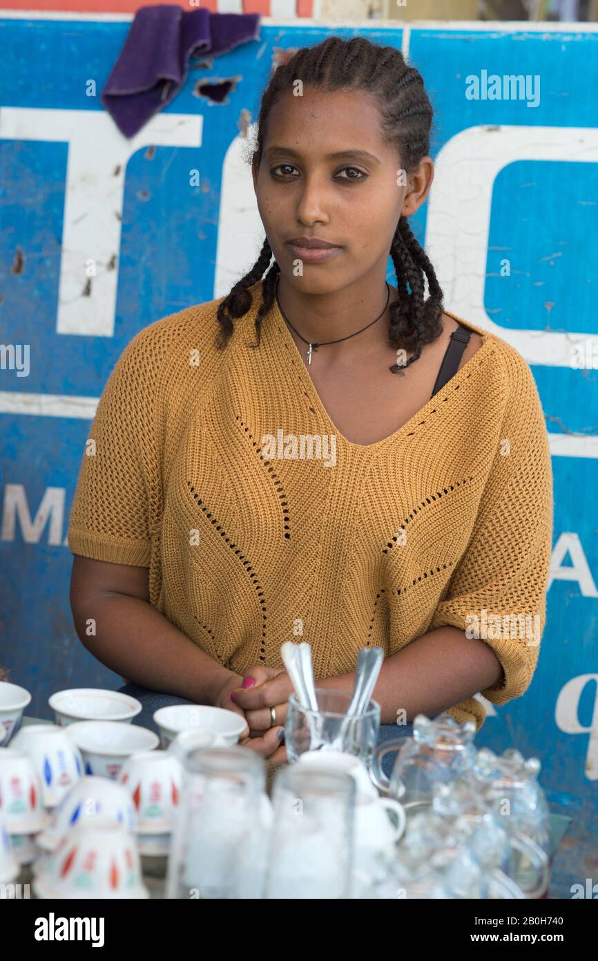 02.11.2019, Adama, Oromiyaa, Ethiopia - Traditional street coffee seller. Internally displaced person (IDP) from the Amhara region supported by the Wo Stock Photo