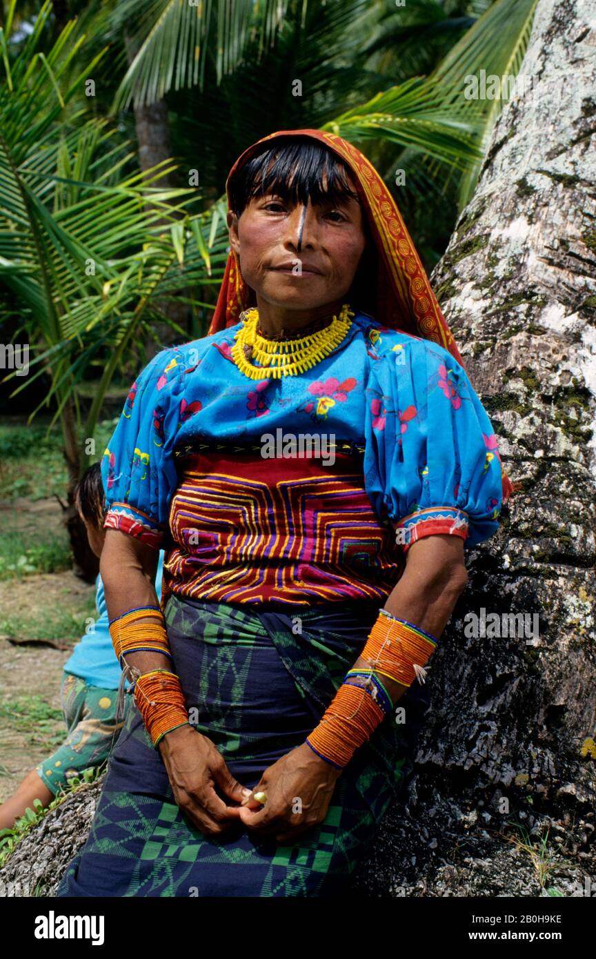 Panama San Blas Islands Acuatupu Island Kuna Indian Woman Leaning Against Tree Stock Photo