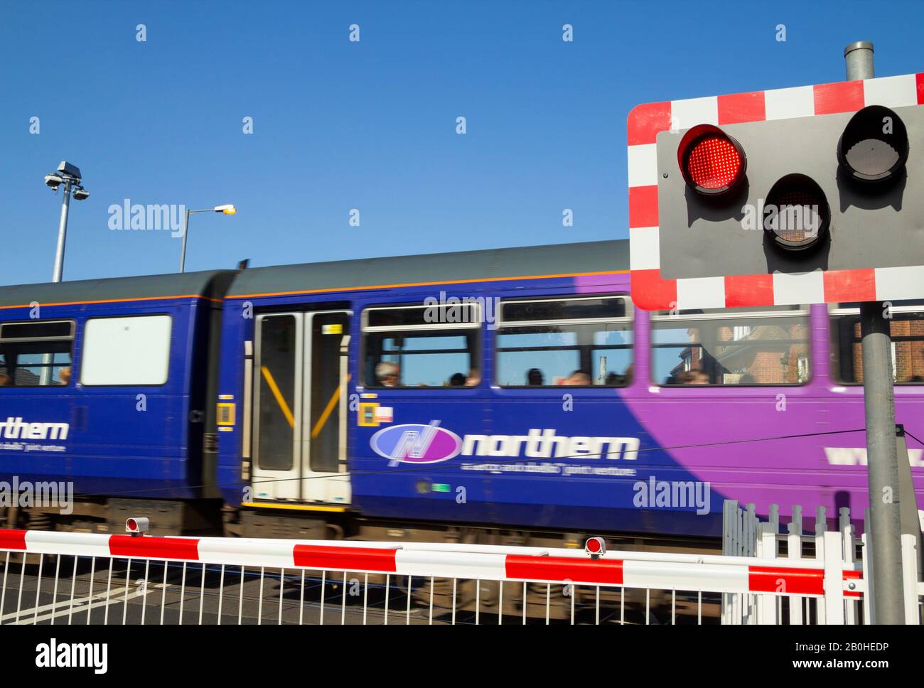 Northern Rail train passing level crossing in Billingham, north east England. UK Stock Photo