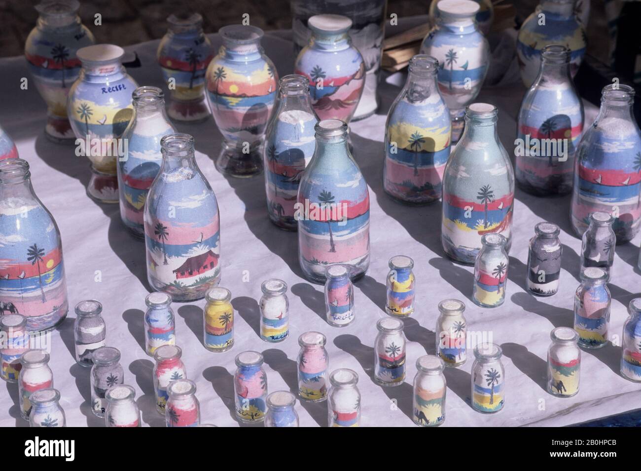 BRAZIL, RECIFE, SOUVENIER STANDS, GLASS BOTTLES FILLED WITH COLORFUL SANDS Stock Photo