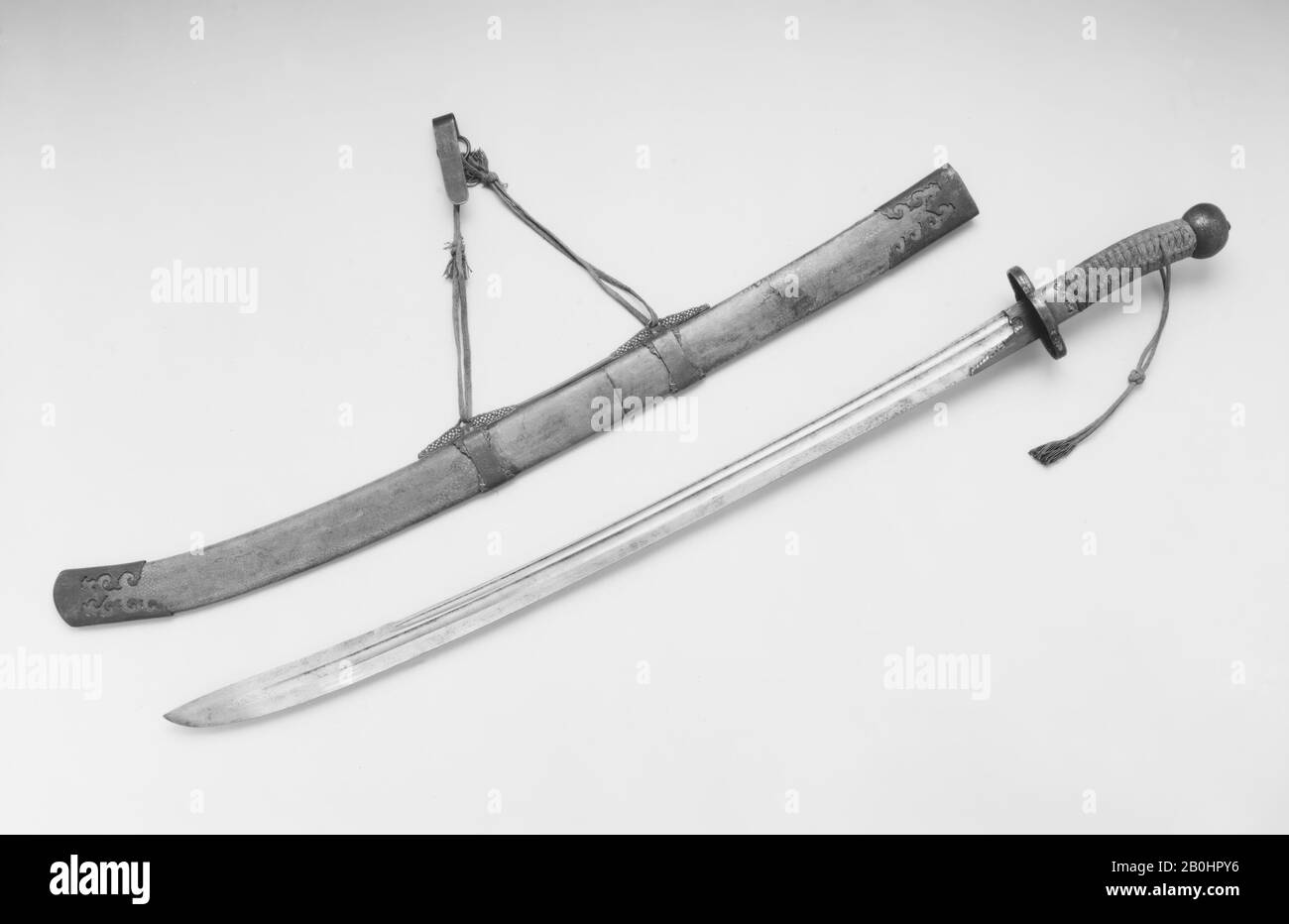 Sword with Scabbard and Belt Hook, Chinese, 18th century, Chinese, Steel, gold, brass, shark skin, wood, textile, H. with scabbard 39 1/2 in. (100.3 cm); H. without scabbard 38 in. (96.5 cm); H. of blade 31 3/4 in. (80.7 cm); W. 3 1/2 in. (8.9 cm); Wt. 1 lb. 11.5 oz. (779.6 g); Wt. of scabbard 15.1 oz. (428.1 g), Swords Stock Photo
