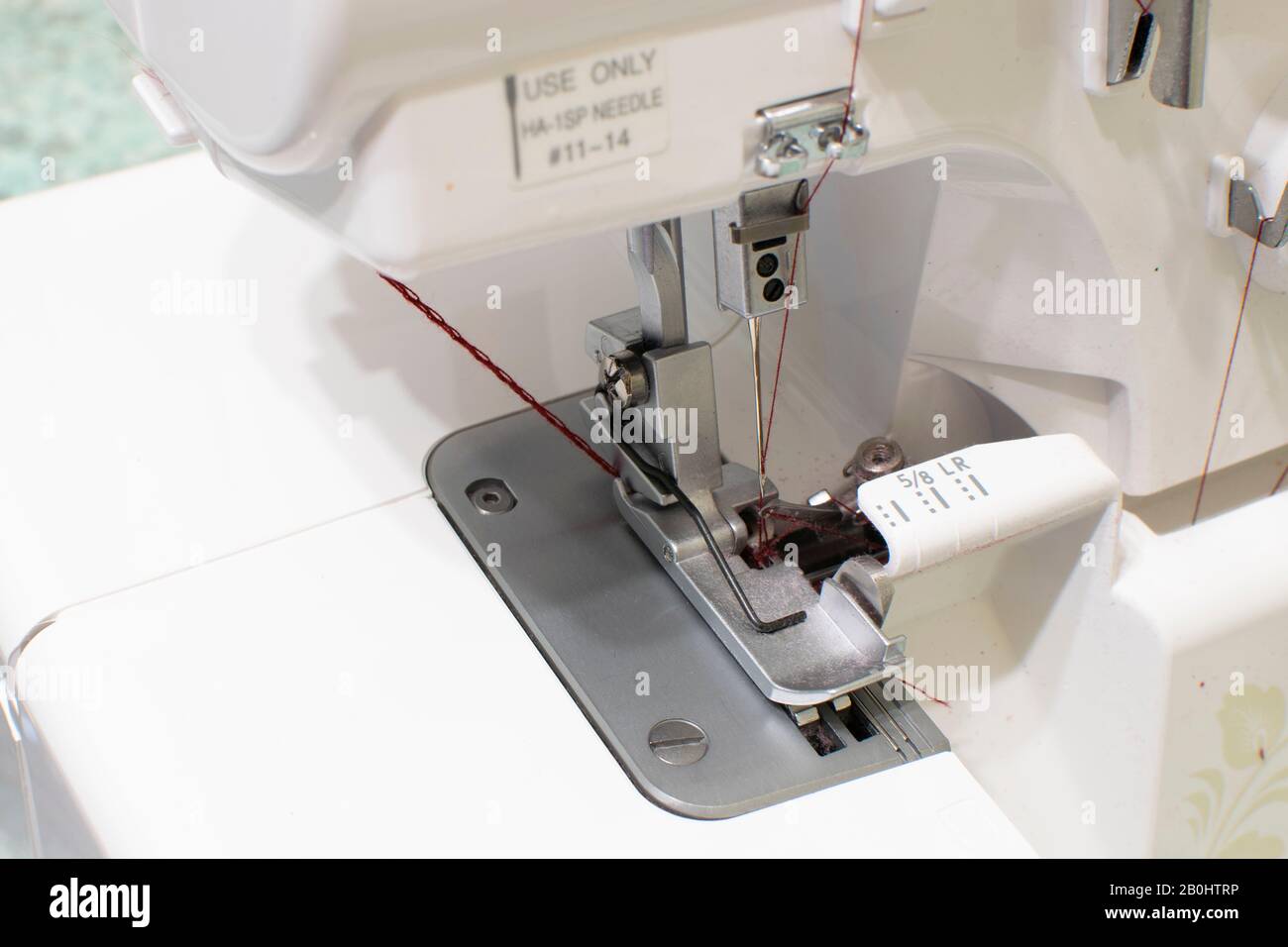 sewing machine for wrapping sections of textile materials Stock Photo