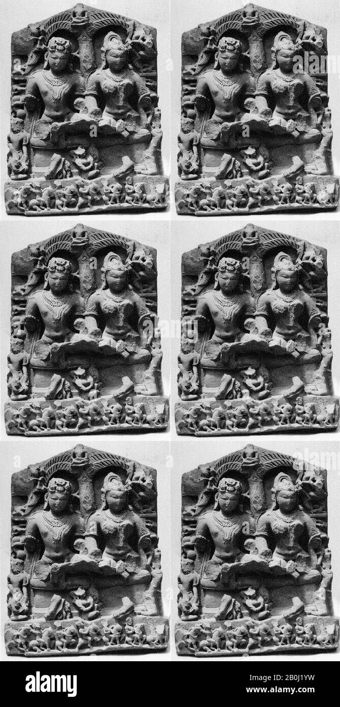 Parents of a Jina, India (Gwalior, Jhansi), 10th–11th century, India (Gwalior, Jhansi), Reddish stone, H. 33 3/4 in. (85.7 cm); W. 25 3/4 in. (65.4 cm); D. 11 in. (27.9 cm), Sculpture Stock Photo