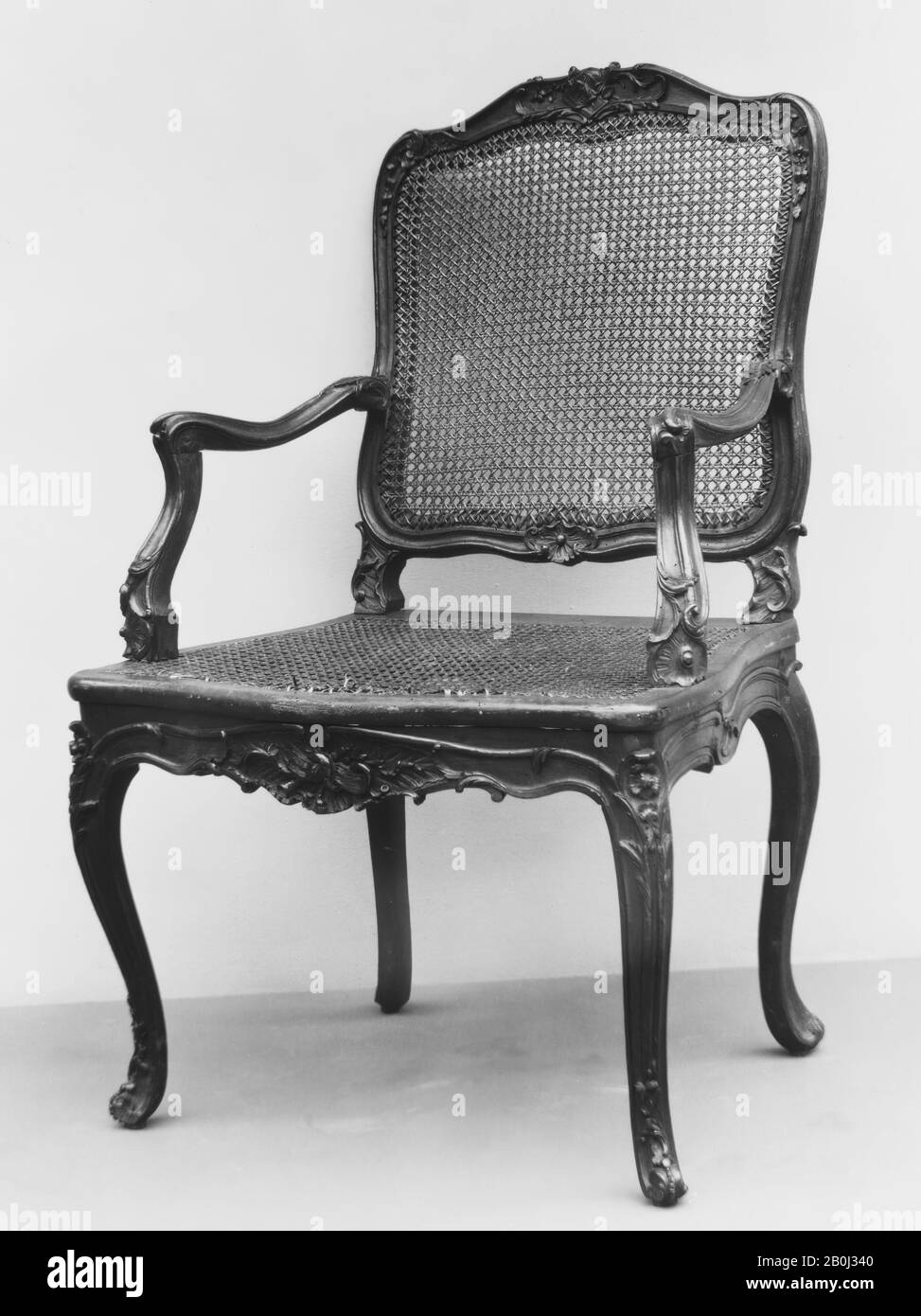 Armchair, French, mid-18th century, French, Carved fruitwood; caning, Overall: 41 3/4 × 25 3/8 × 20 1/2 in. (106 × 64.5 × 52.1 cm), Woodwork-Furniture Stock Photo