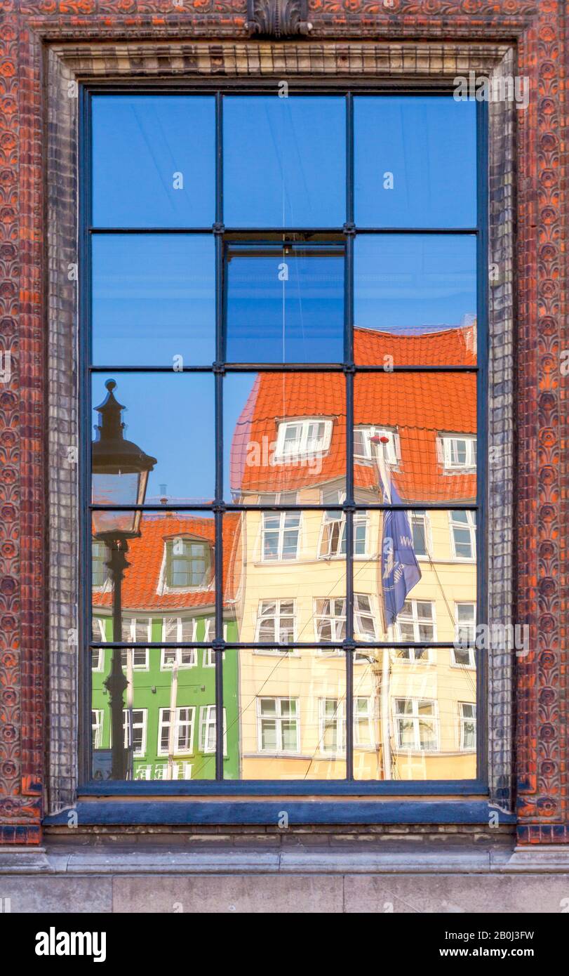 Reflections in window panes of colourful buildings in Nyhavn, Copenhagen Stock Photo